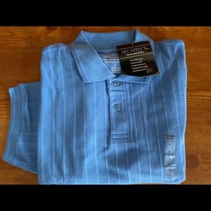 Brand new with tags on blue polo shirt very nice.